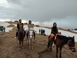 three teammate riding a horse